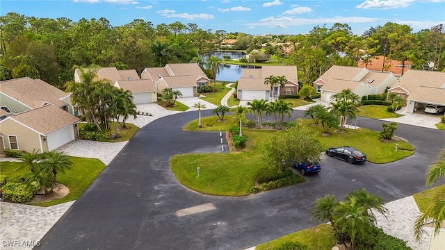 birds eye view of property with a water view