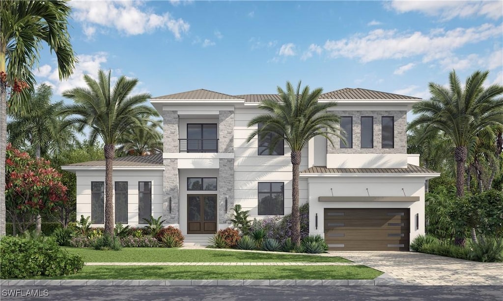 view of front facade with a garage and a front yard