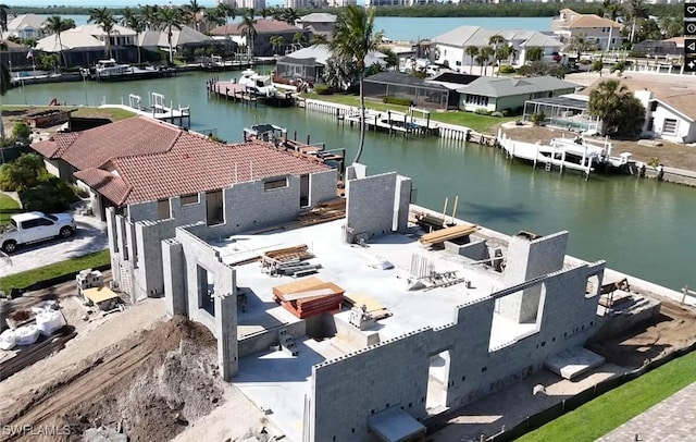 bird's eye view featuring a water view and a residential view