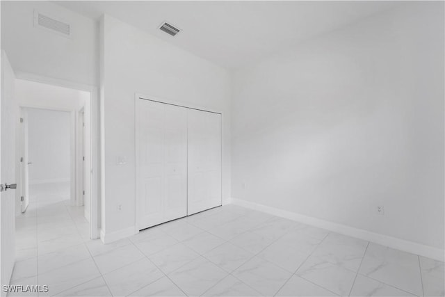 unfurnished bedroom featuring a closet