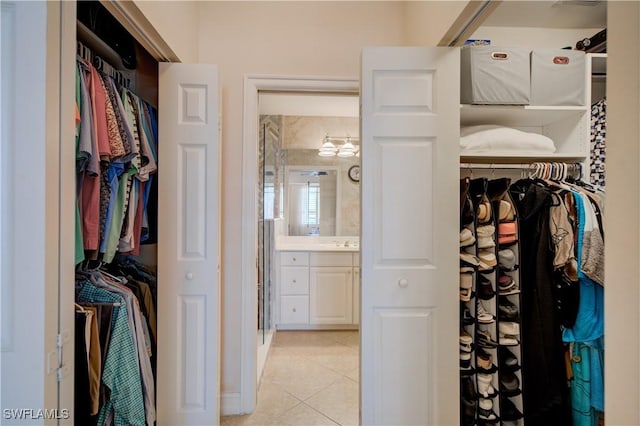 walk in closet featuring light tile patterned floors