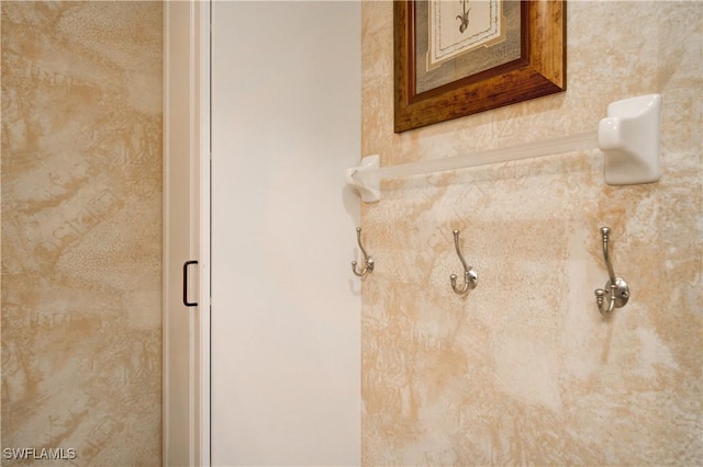 interior details featuring an enclosed shower