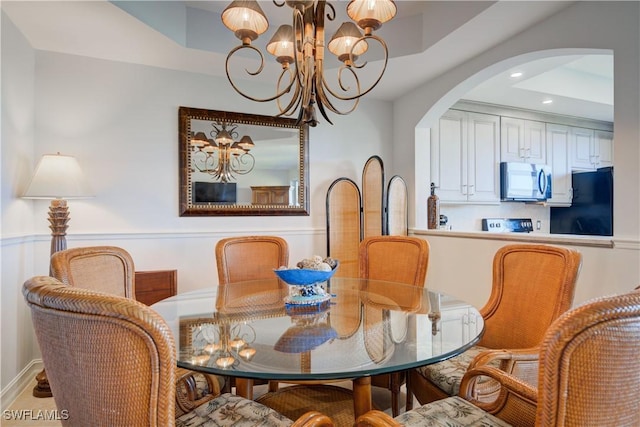 dining area featuring a chandelier