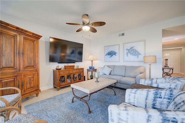 carpeted living room featuring ceiling fan