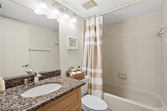 bathroom featuring shower / bath combination with curtain, visible vents, vanity, and toilet