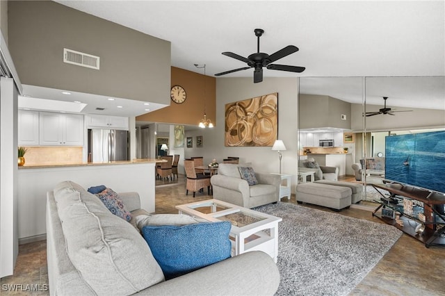 living area with high vaulted ceiling, visible vents, and a ceiling fan