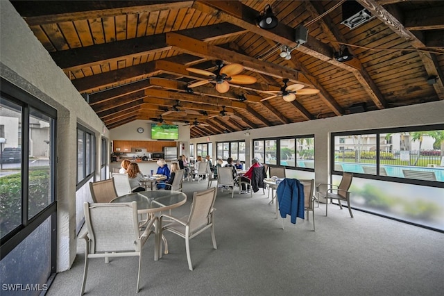 unfurnished sunroom with lofted ceiling with beams and wood ceiling