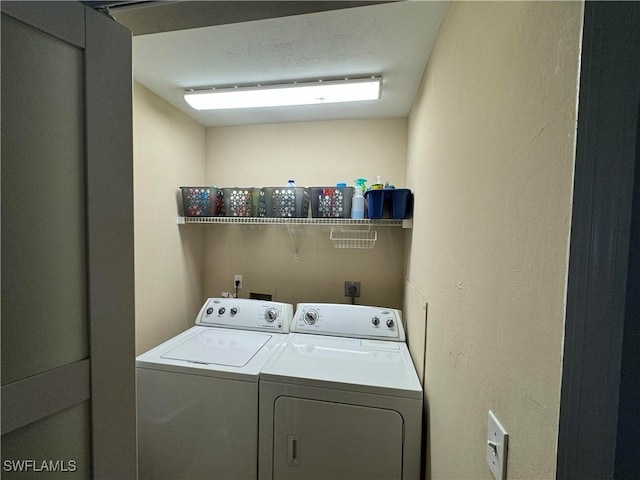 washroom with washing machine and dryer