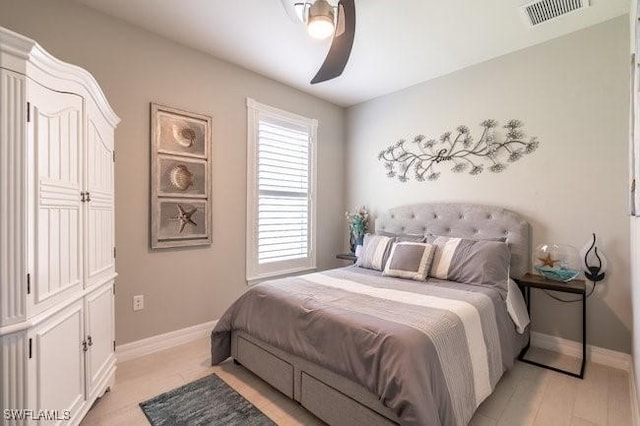 bedroom with ceiling fan and light hardwood / wood-style flooring