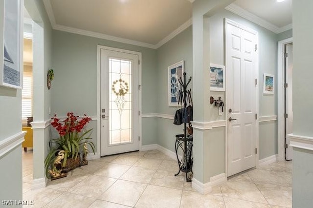 entrance foyer featuring a healthy amount of sunlight and ornamental molding