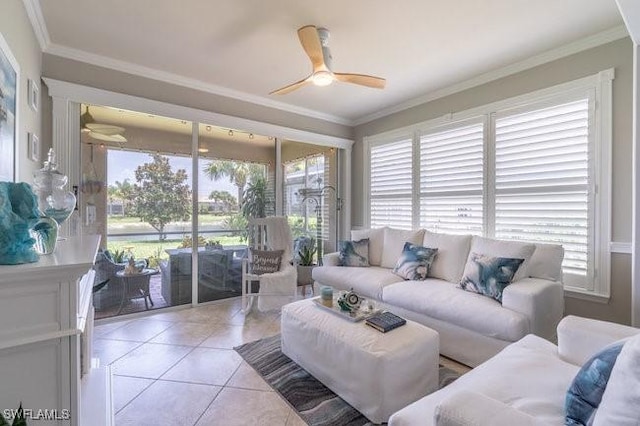 tiled living room with ceiling fan and ornamental molding