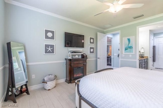 bedroom with light hardwood / wood-style floors, ceiling fan, and ornamental molding