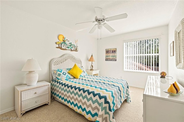 bedroom with light carpet and ceiling fan