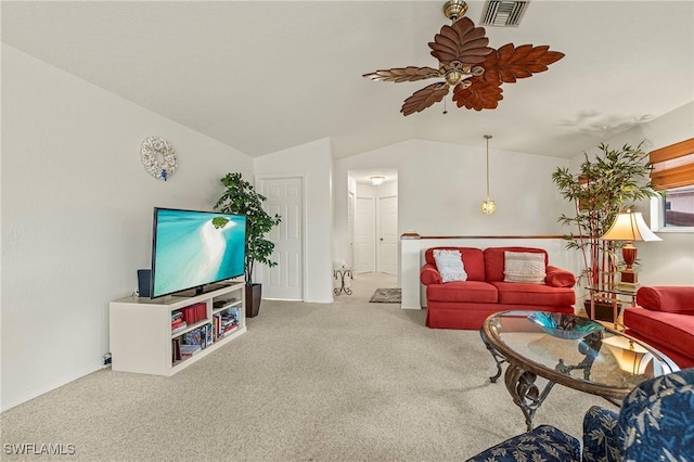 carpeted living room with ceiling fan and lofted ceiling