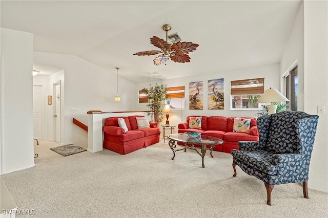 living room featuring carpet flooring, ceiling fan, and vaulted ceiling