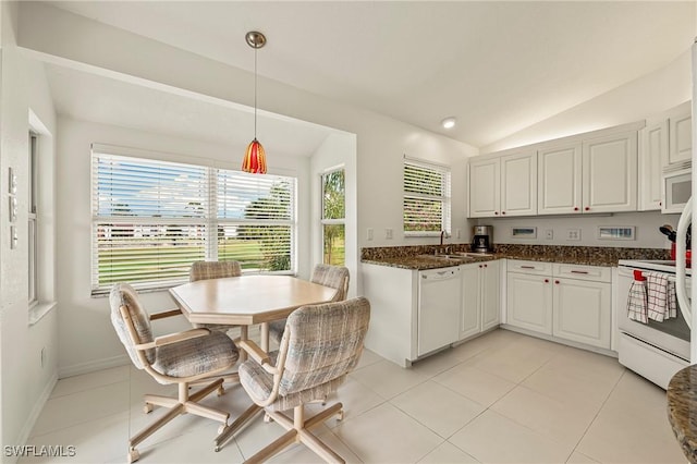 kitchen featuring white cabinetry, white appliances, lofted ceiling, and hanging light fixtures