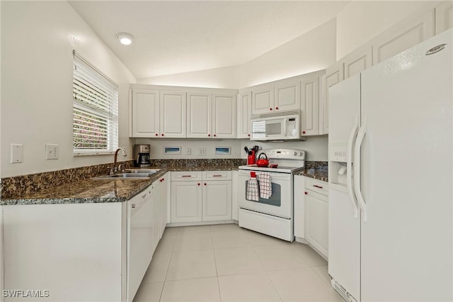 kitchen with white cabinetry, sink, vaulted ceiling, white appliances, and light tile patterned floors