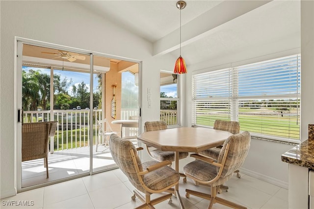 dining room with light tile patterned floors, plenty of natural light, and ceiling fan