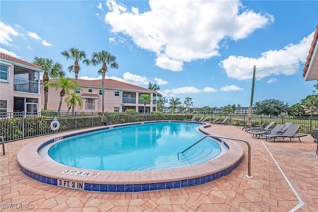 view of swimming pool with a patio area