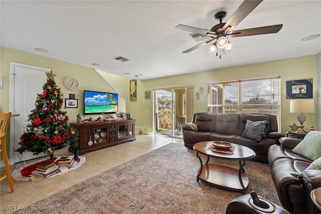 living room featuring ceiling fan and light tile patterned floors