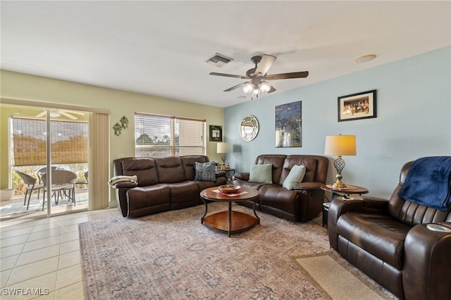 living room with ceiling fan and light tile patterned floors