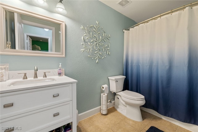 bathroom featuring tile patterned floors, vanity, curtained shower, and toilet