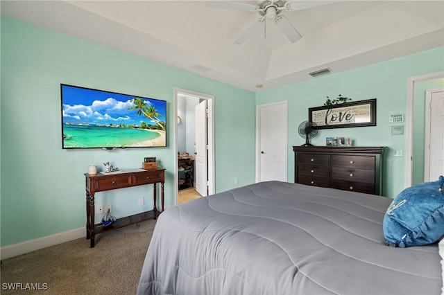 carpeted bedroom featuring ensuite bath and ceiling fan