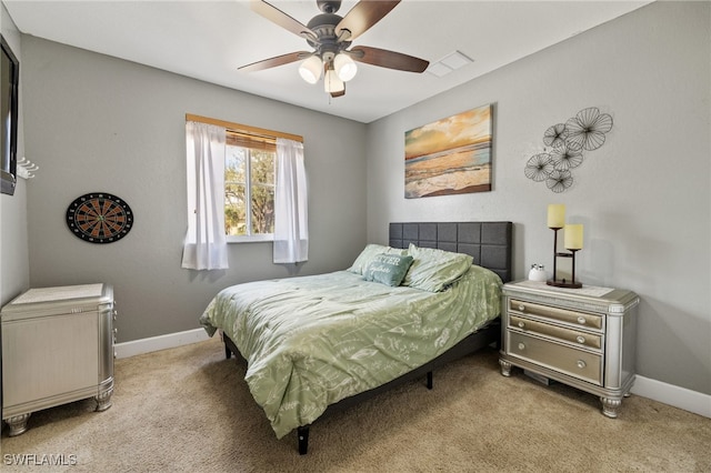 bedroom with ceiling fan and light carpet