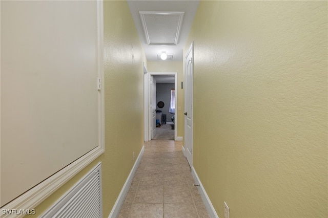 hall featuring light tile patterned flooring