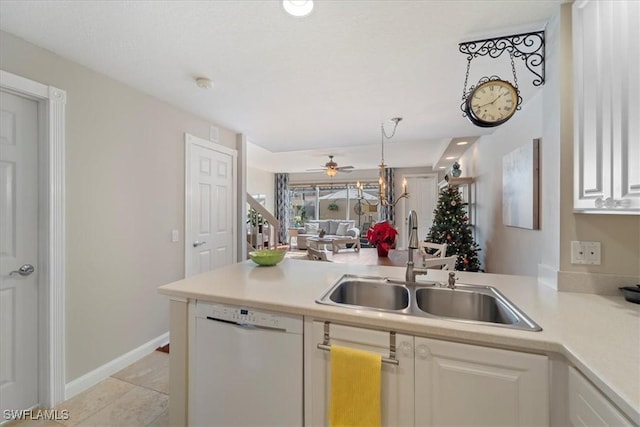 kitchen featuring kitchen peninsula, white dishwasher, white cabinetry, and sink