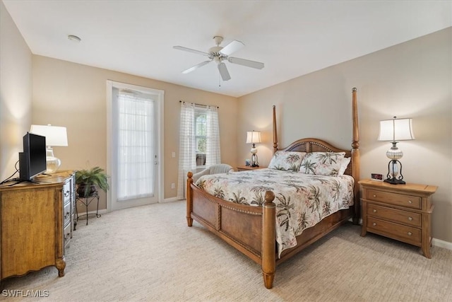 carpeted bedroom with ceiling fan and access to outside