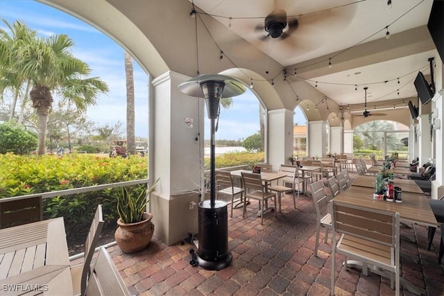 view of patio / terrace featuring ceiling fan