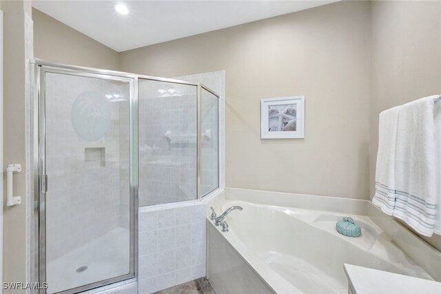 bathroom with separate shower and tub