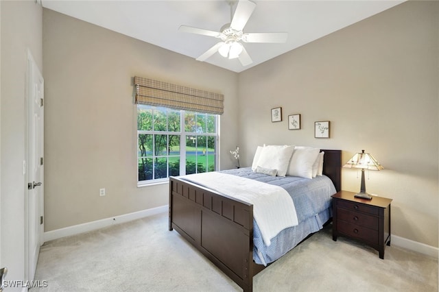 bedroom with ceiling fan and light colored carpet