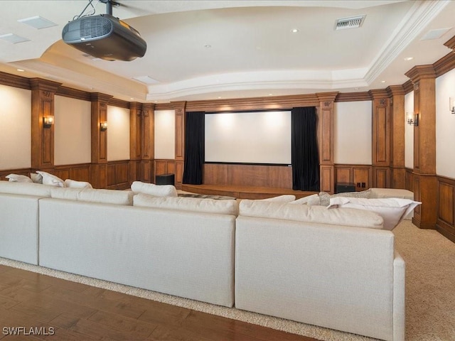 cinema featuring crown molding and a tray ceiling