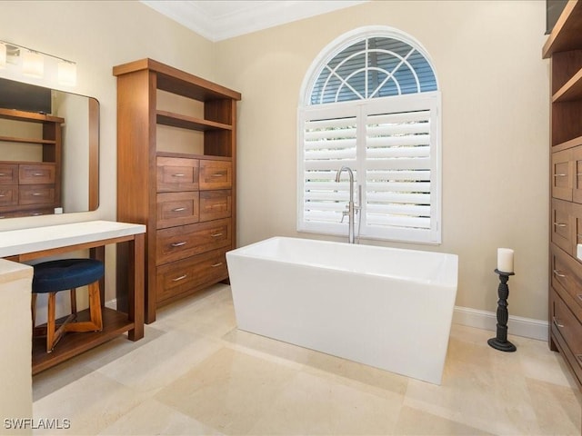 bathroom featuring crown molding, vanity, and a bath