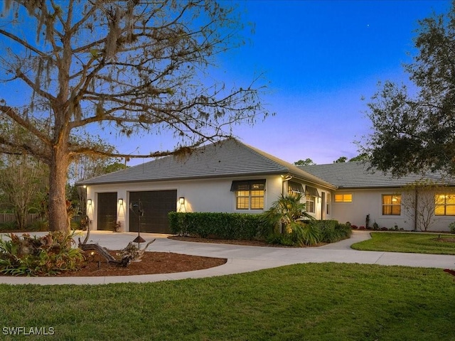 exterior space with a lawn and a garage