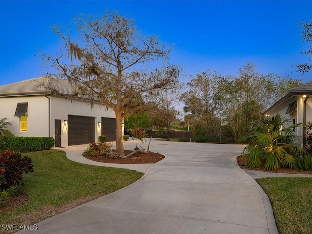 surrounding community featuring a lawn and a garage