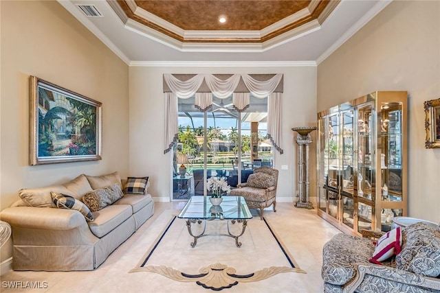 living room featuring a raised ceiling and crown molding