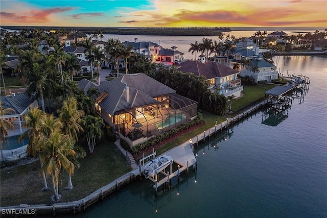 aerial view at dusk with a water view