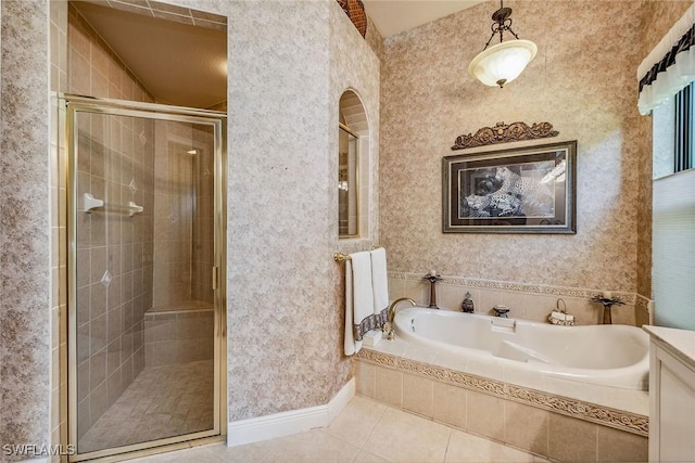 bathroom featuring tile patterned floors, vanity, and separate shower and tub