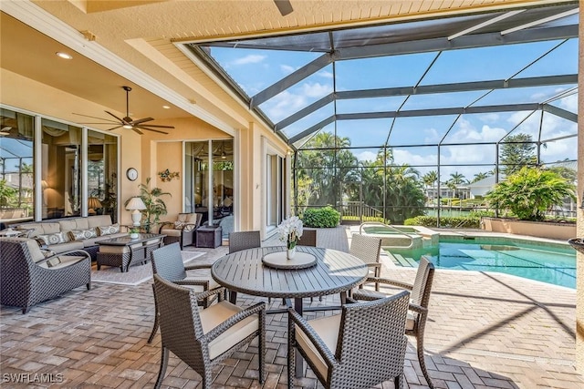 view of swimming pool with outdoor lounge area, a patio area, glass enclosure, and an in ground hot tub