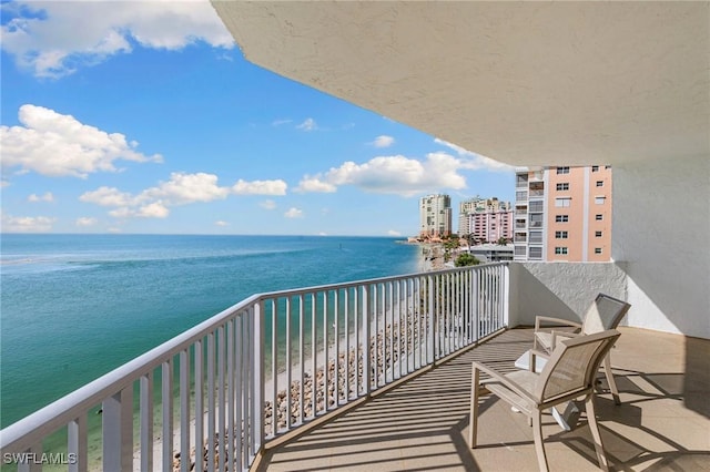 balcony featuring a water view