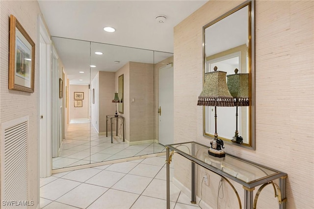 corridor with light tile patterned floors