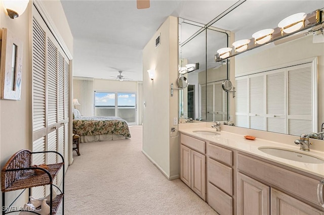 bathroom featuring vanity and ceiling fan