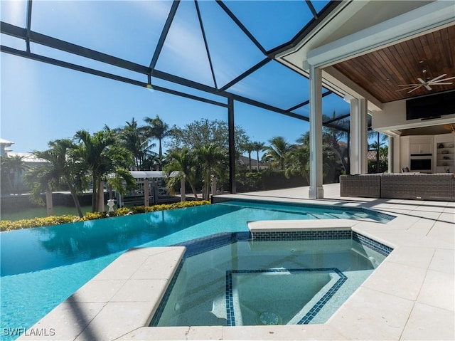 view of swimming pool with a lanai, a patio, an in ground hot tub, and outdoor lounge area