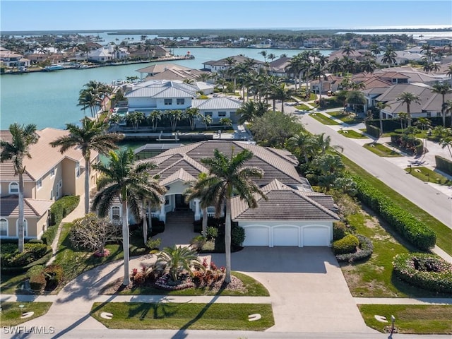 birds eye view of property featuring a water view