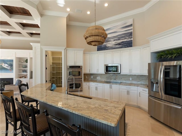 kitchen featuring stainless steel appliances, white cabinetry, tasteful backsplash, coffered ceiling, and beam ceiling