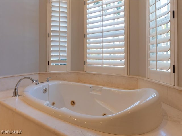 bathroom with tiled bath