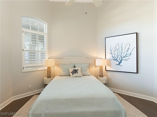 bedroom featuring ceiling fan and dark hardwood / wood-style floors